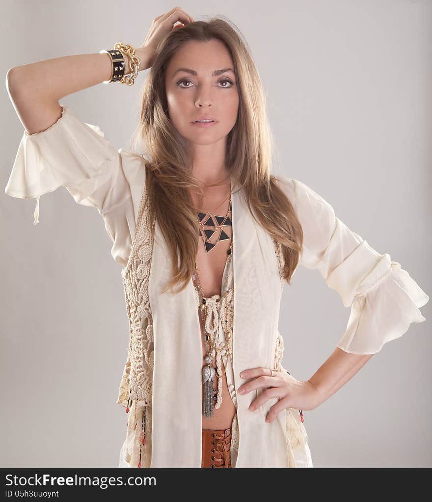 An image of a fashion model in a boho outfit. An image of a fashion model in a boho outfit