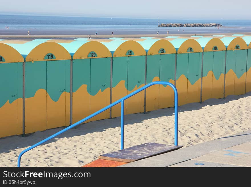 Beach huts alignment on a large beach in northern France