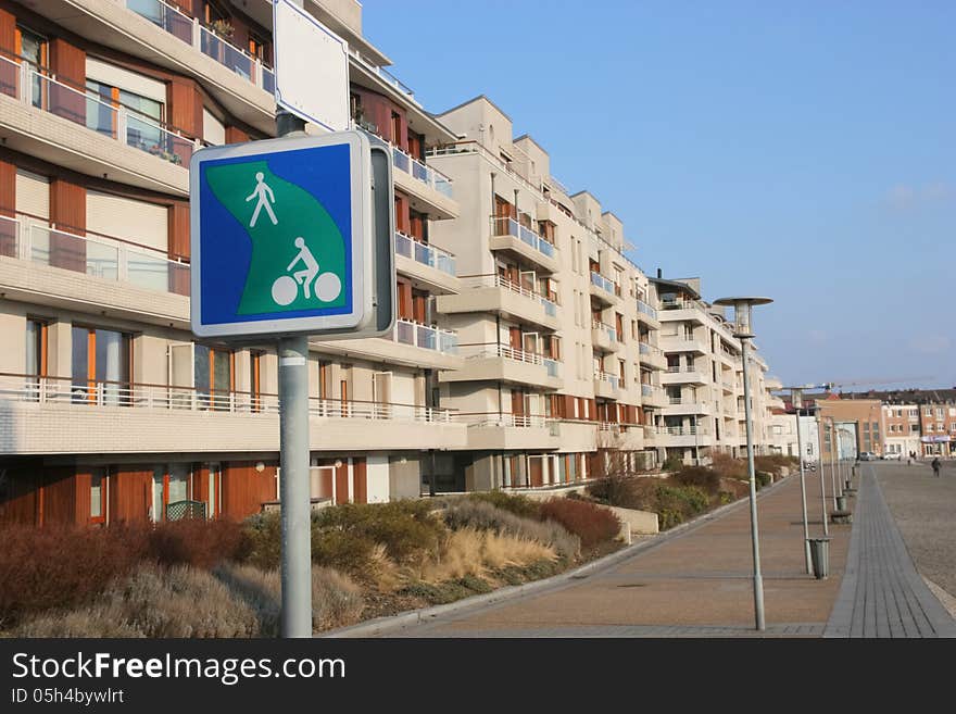 A pedestrian street in a residential area along a harbor basin