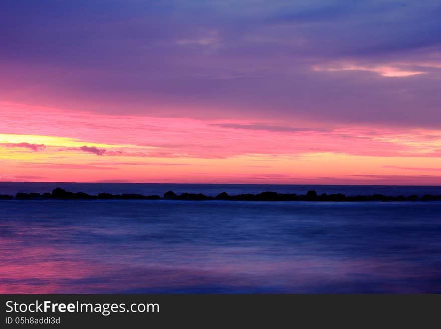 Winter sunrise, the sky in very cloudy but the sea is calm, very relaxing. Winter sunrise, the sky in very cloudy but the sea is calm, very relaxing.