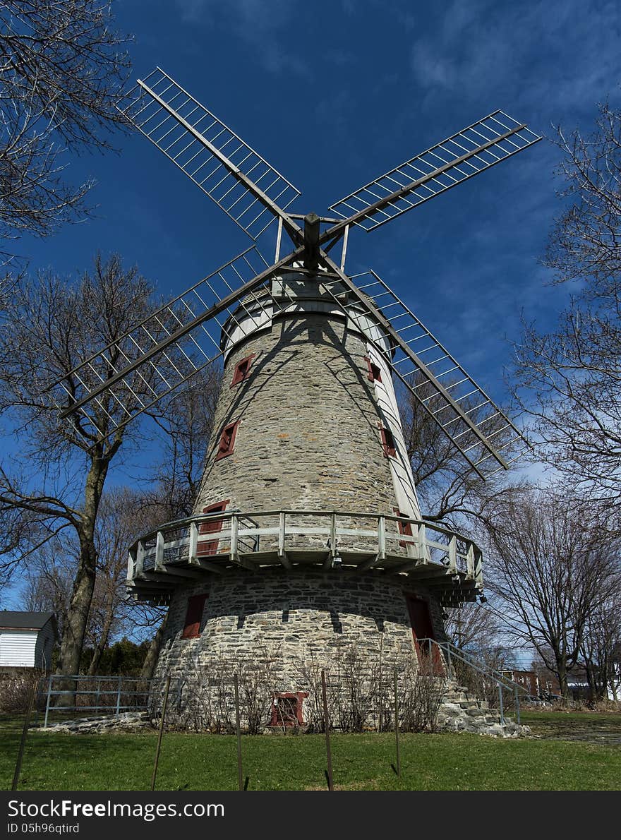 Windmill on a bright blue sky