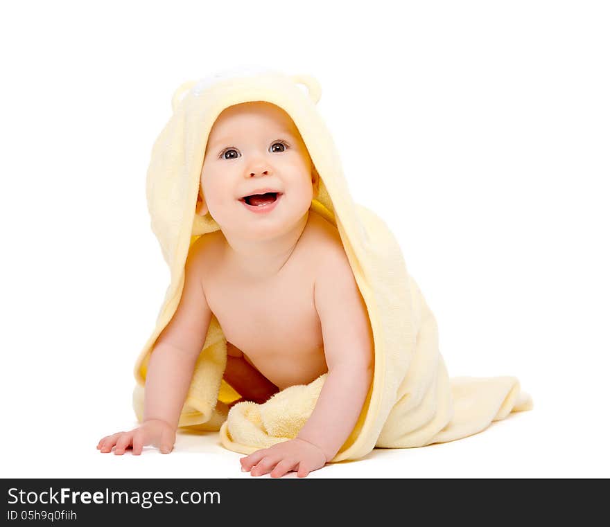 Happy beautiful baby in yellow towel isolated on white background