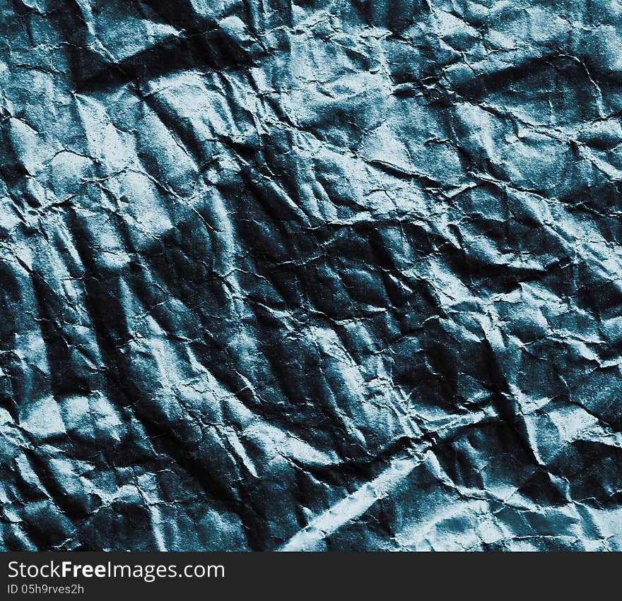 Crumpled black sheet. Paper background. Crumpled black sheet. Paper background