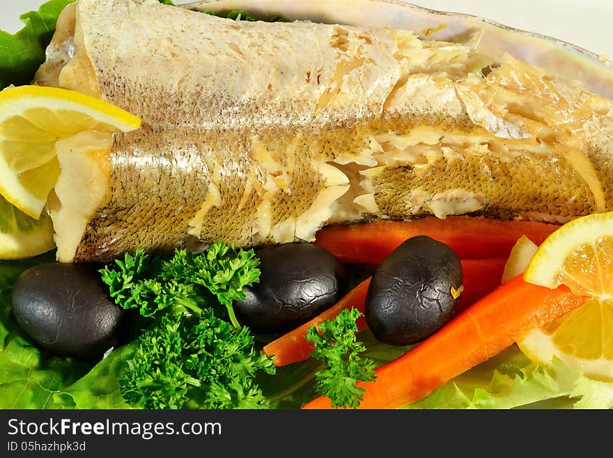 Fish with lemon, vegetables and herbs. Fish with lemon, vegetables and herbs