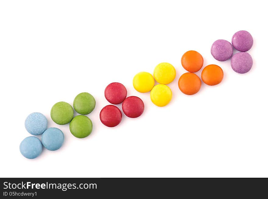 Colored chocolate candy on a white background. Colored chocolate candy on a white background