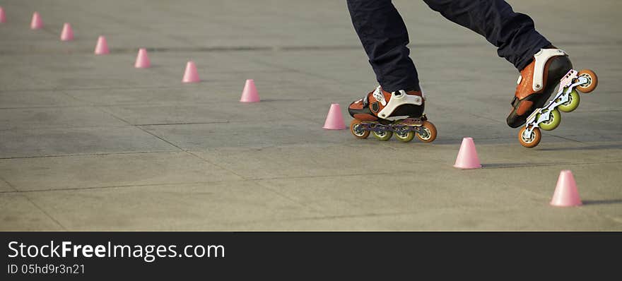 Young man skating through cups.