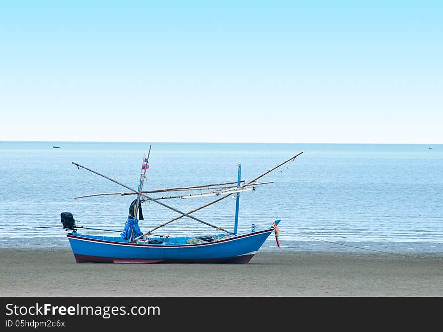 Fishing boat on the sea shore