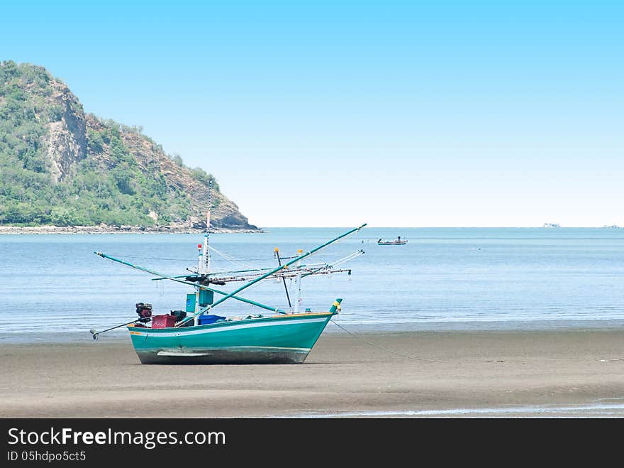 Fishing boat on the sea shore