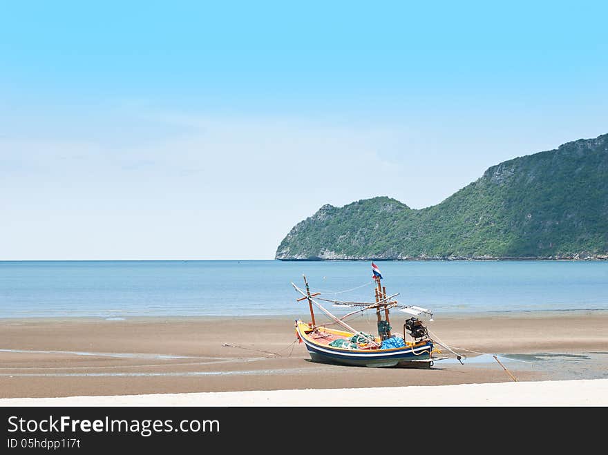 Fishing boat on the sea shore