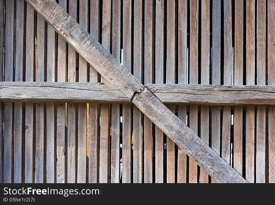 Old enclosure from weathered wooden planks and beams. Old enclosure from weathered wooden planks and beams