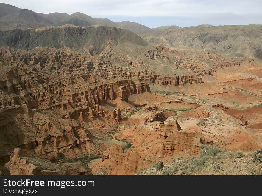 Valley of red mountains. Kyrgyzstan. A red canyon. Red mountains.