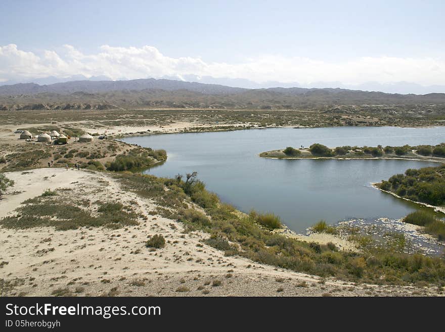 Sandy coast of lake.