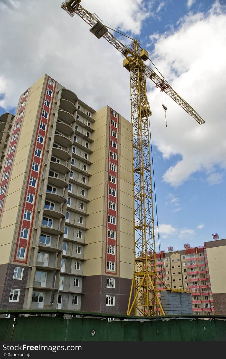 Crane working heavy construction. Modern Architecture.