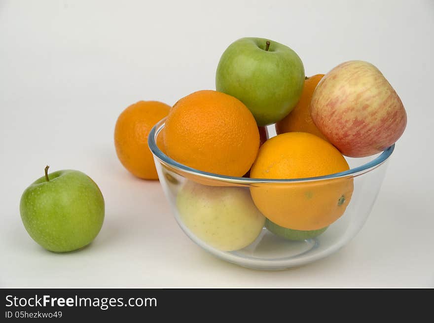 Fresh fruit in glasswares on a white background. Fresh fruit in glasswares on a white background.