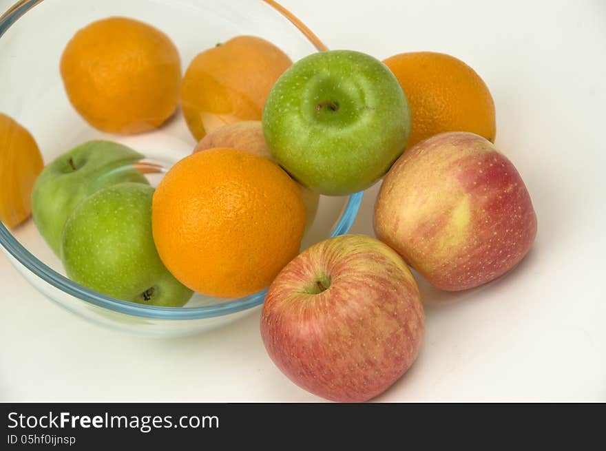 Fresh fruit in glasswares on a white background. Fresh fruit in glasswares on a white background.