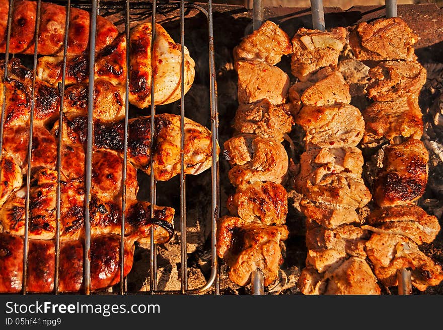 Grilled meat and chicken on barbecue. Grilled meat and chicken on barbecue