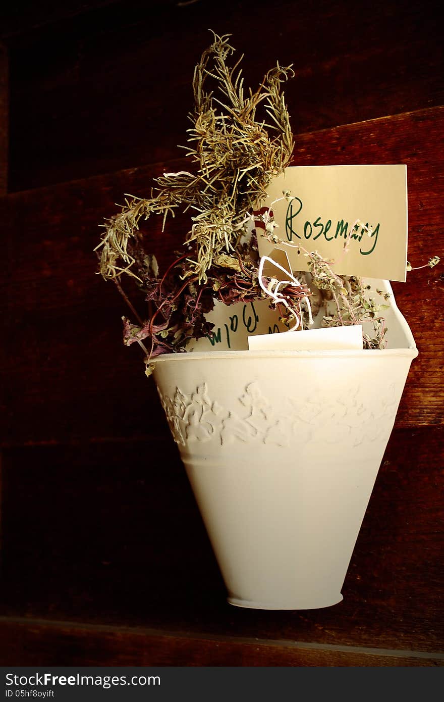 Dry flowers in a hanging basket.