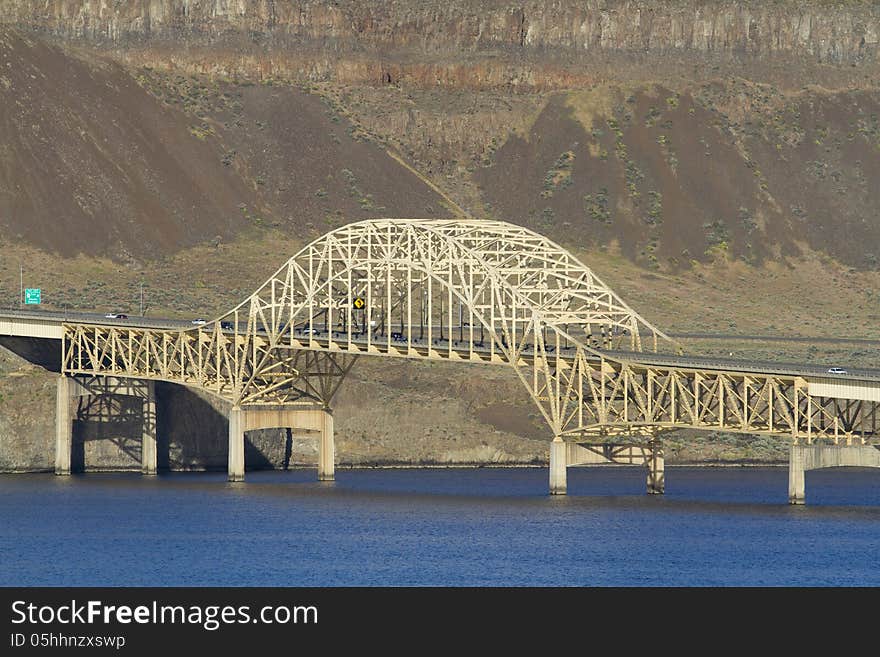 I-90 Vantage Bridge over the Columbia River Gorge in central Washington State Wide Angle with blue sky blue water rocky dry desert mountain hill Vantage