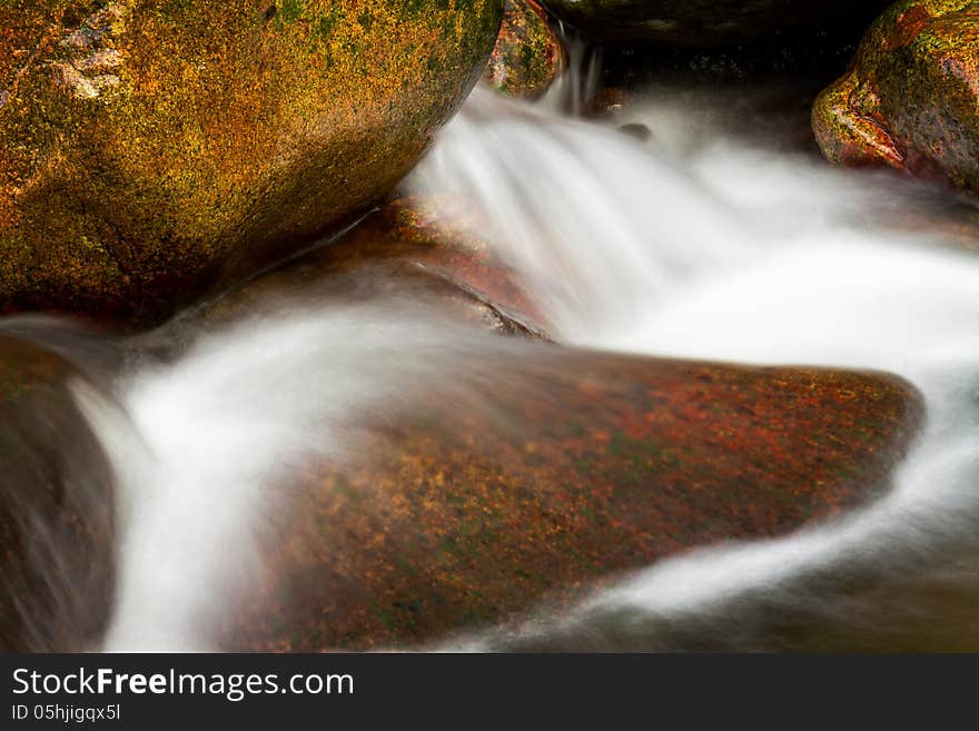 Beautiful veil cascading waterfall, mossy rocks