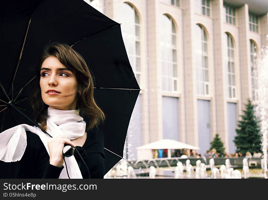 Beautiful girl with an umbrella