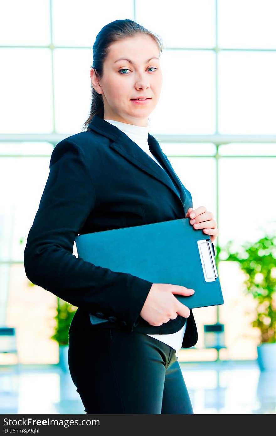 A Smiling Girl Holding A Manager Office Folder