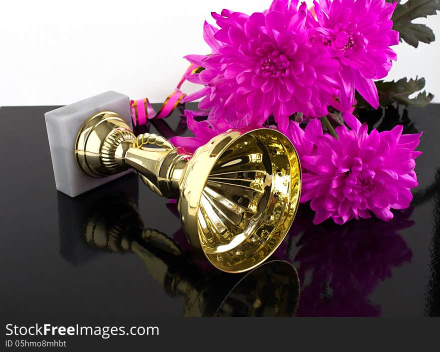 Premium cup and a bouquet of roses on a black background