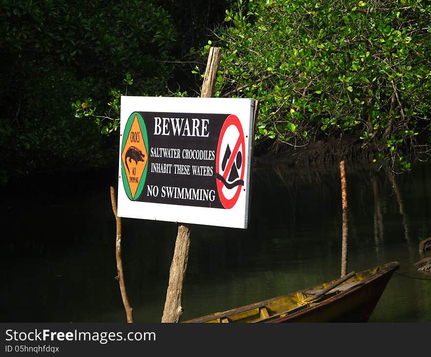 This NO SWIMMING danger tag was placed inside a sea bay to alert people the presence of crocodiles. This NO SWIMMING danger tag was placed inside a sea bay to alert people the presence of crocodiles.