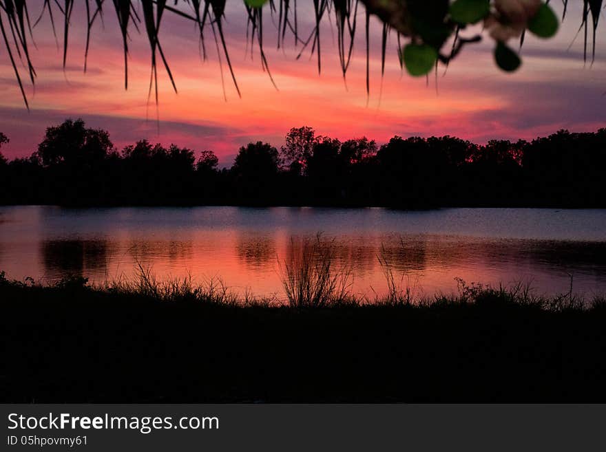 Trees silhouette on sunset Thailand river. Trees silhouette on sunset Thailand river