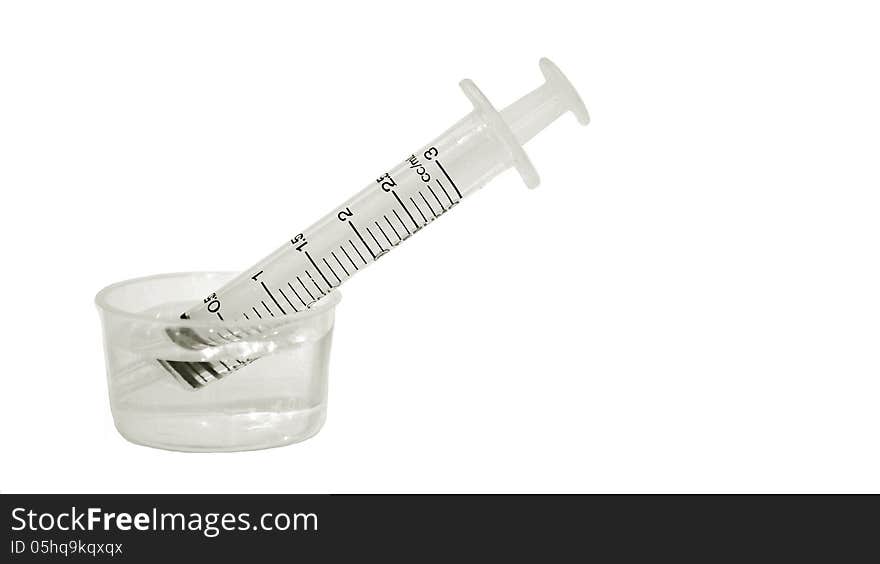 A syringe on white background