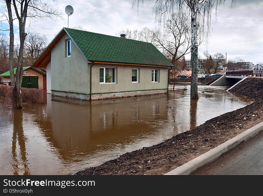 Flooding river flooded town house