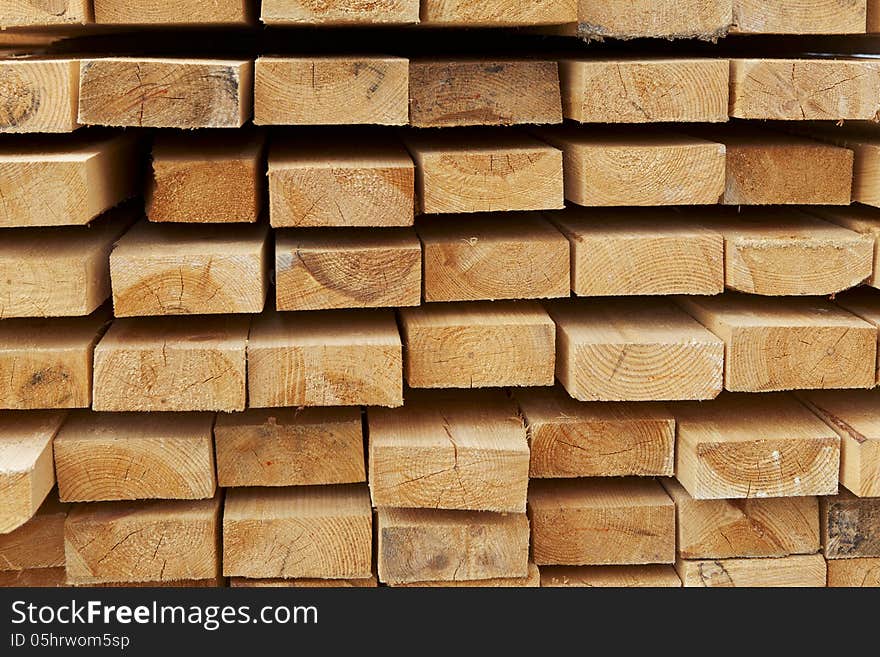 Stack of pine boards on building materials warehouse