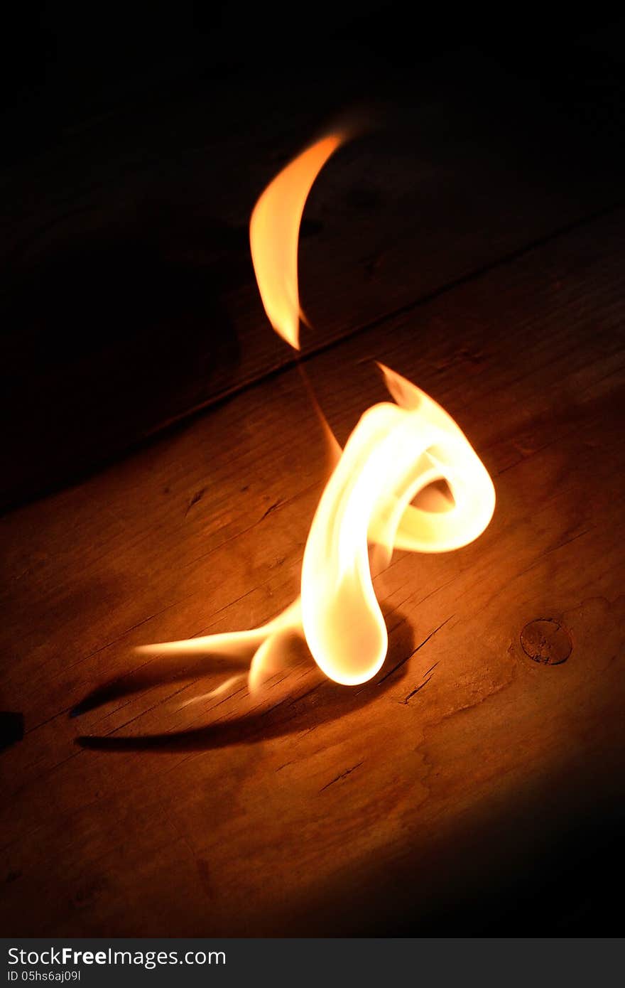 Flame of gas burner on the wooden floor. Flame of gas burner on the wooden floor.