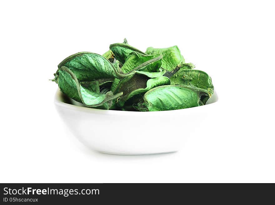 Aromatic green leaves in a bowl of sauces. Aromatic green leaves in a bowl of sauces.