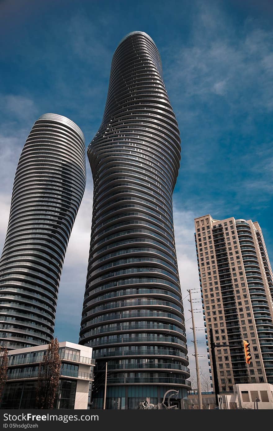 Main objects two tall modern style shape buildings. Main objects two tall modern style shape buildings