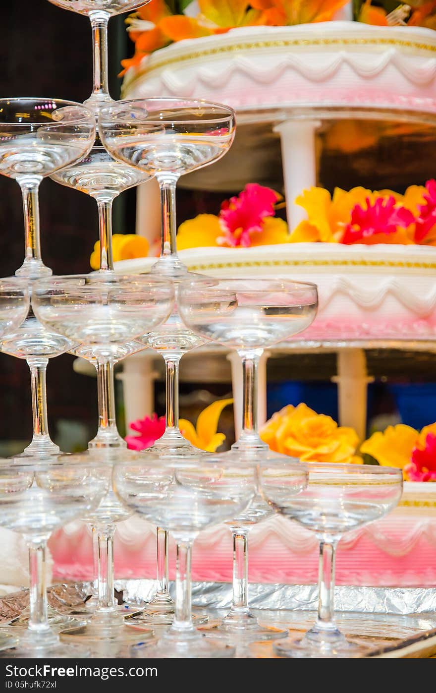 Champagne glasses with cake at the back