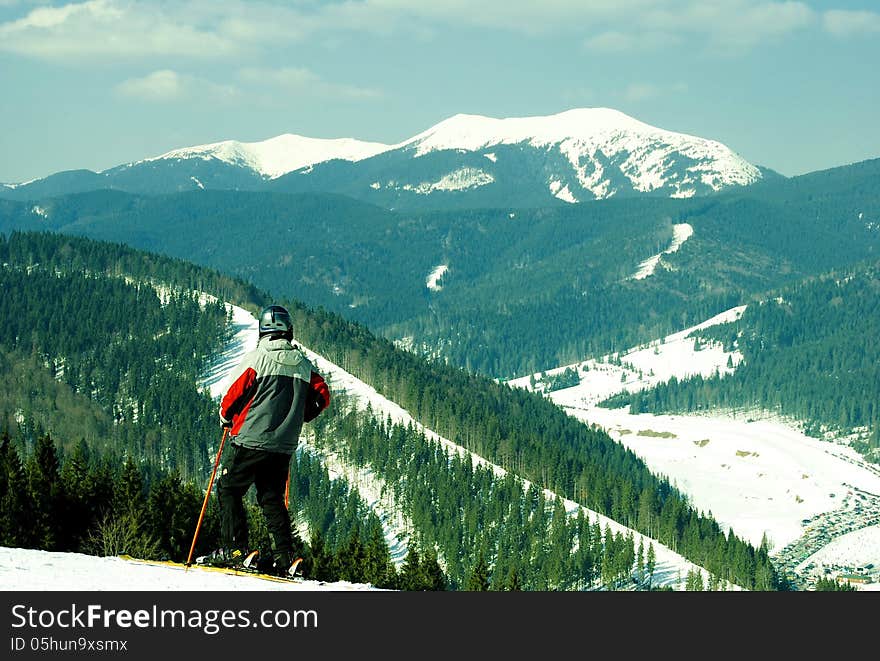 Skier on a background of mountains