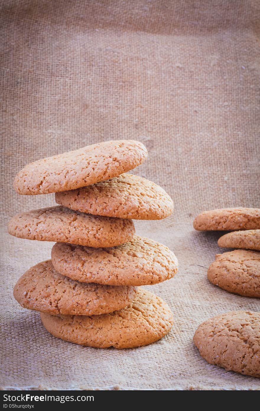 Freshly baked homemade cookies on the sacking background. Freshly baked homemade cookies on the sacking background