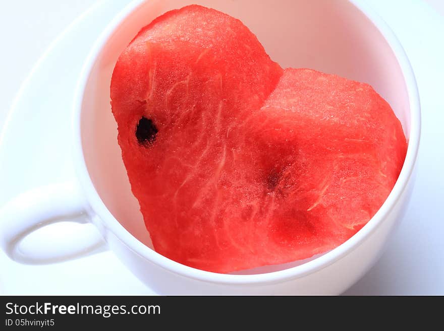 Water melon cut into heart shape. Water melon cut into heart shape.