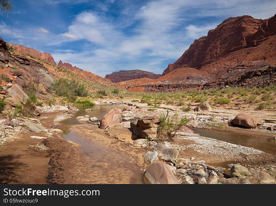 The Paria Canyon is located in Arizona and Utah, and is a 38 mile long canyon trip by means of backpacking. One makes thousands of stream crossings in this spectacular area, until the canyon widens out and ends in Lee's Ferry, Arizona.