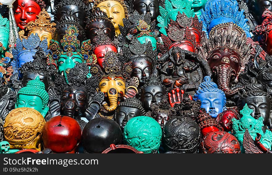 Detail of various wooden carved masks and decorations, market in Kathmandu