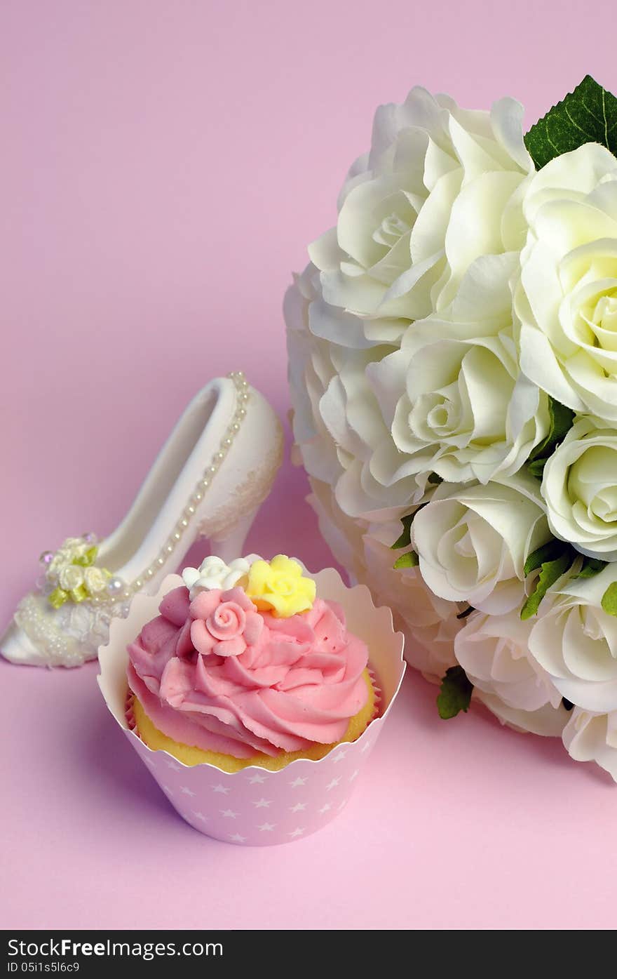 Wedding white roses bouquet with pink cupcake and good luck shoe.- vertical. Wedding white roses bouquet with pink cupcake and good luck shoe.- vertical.