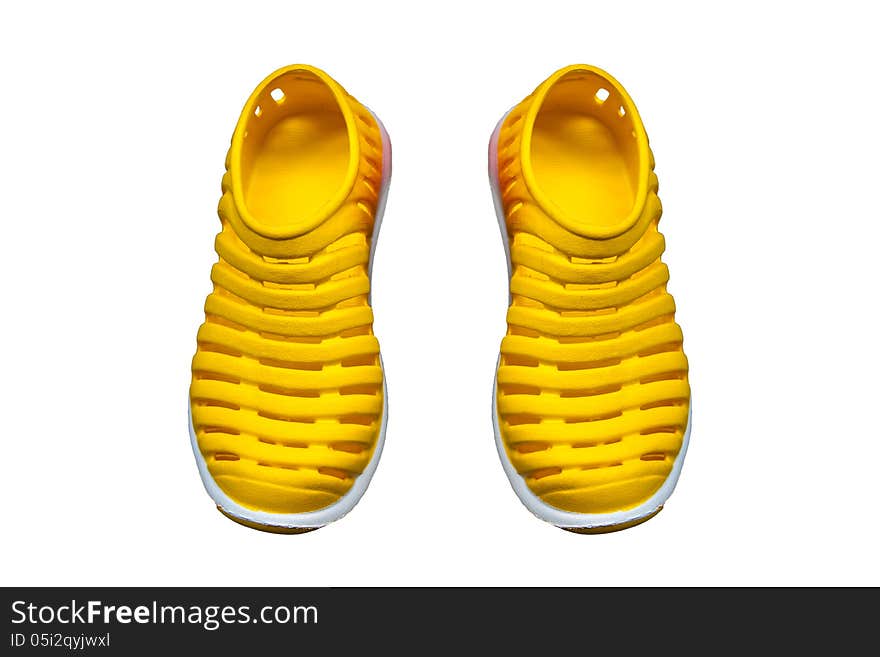 Bright yellow clogs isolated on white background. Bright yellow clogs isolated on white background.