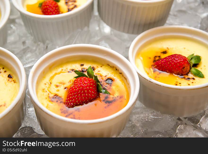 Strawberry Puddings in white bowls