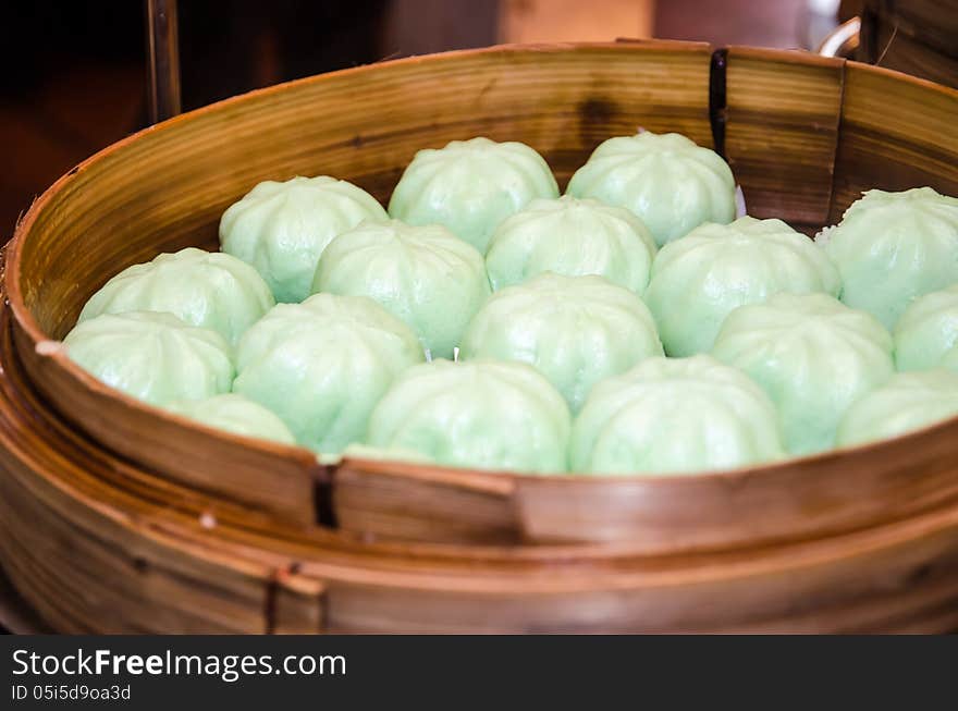 Steamed bun in a bamboo steamer