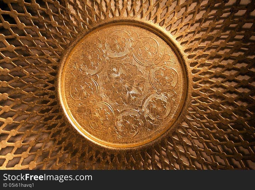 Golden oriental dishware symbol of wealth