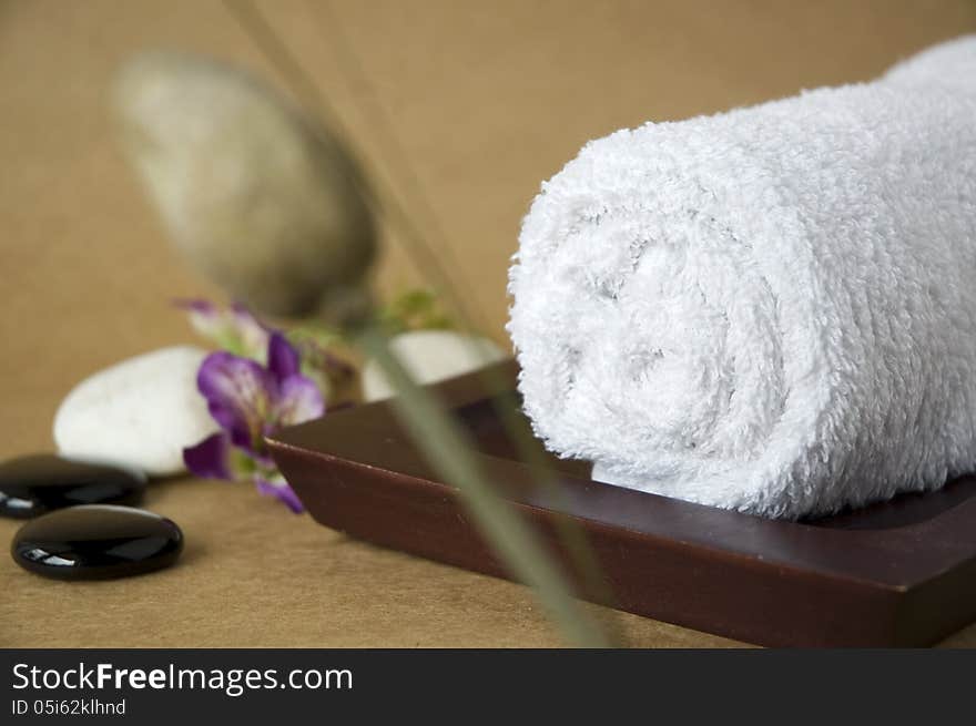 White towel on wooden tray for spa. White towel on wooden tray for spa