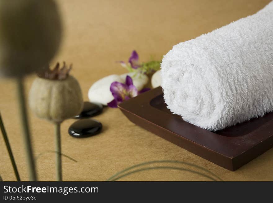 White towel on tray with flowers. White towel on tray with flowers