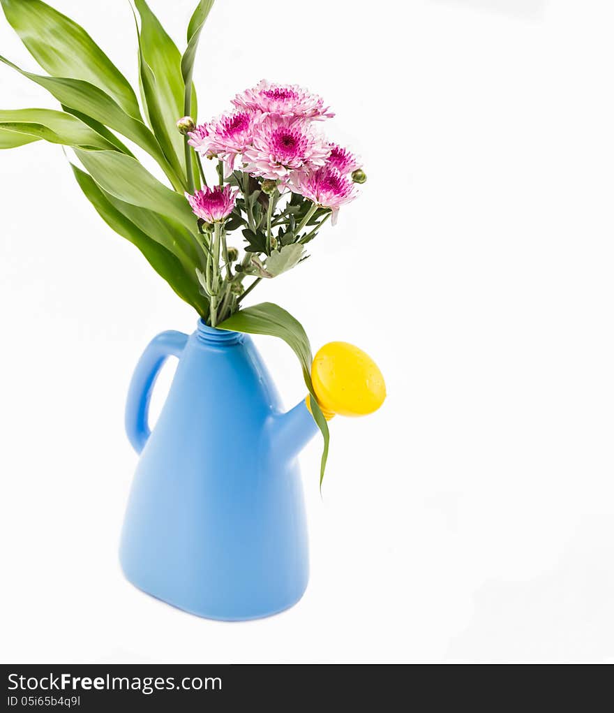 Flowers in blue watering can. Flowers in blue watering can.