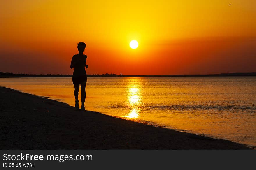 Young Girl Runs Along The Sea Coast