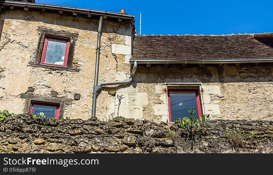 Facade of the old residential house in Chatillon-sur-Indre, France.